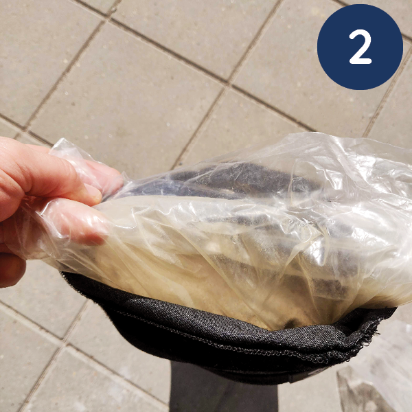 How to fill the Baser sandbags step 2: Fold the plastic bag into the sandbag